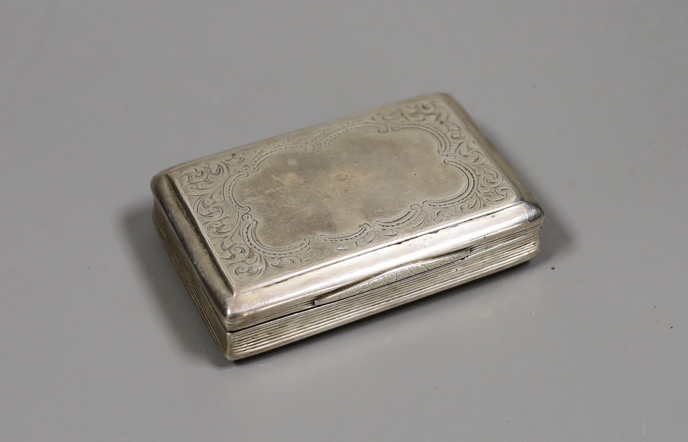 A Victorian engraved silver rectangular snuff box, Frederick Marson, Birmingham, 1861, 84mm.